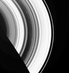 The dark B ring of Saturn is highlighted here by numerous faint spokes. The two most prominent spokes are seen below and to the right of center as seen by NASA's Cassini spacecraft.