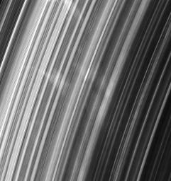This group of spokes in Saturn's B ring extends over more than 5,000 kilometers (3,100 miles) radially across the ringplane as seen by NASA's Cassini spacecraft.