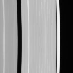 This view from NASA's Cassini spacecraft shows details of Saturn's outer A ring, including the Encke and Keeler gaps. The A ring brightens substantially outside the Keeler Gap.