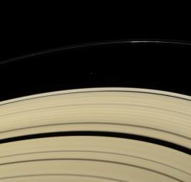Across the expanse of Saturn's rings, NASA's Cassini spacecraft spies two small moons in consort. Atlas is seen exterior to the bright outer edge of the A ring. Daphnis, below Atlas in this view, orbits Saturn within the narrow Keeler Gap.