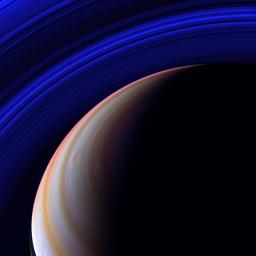 NASA's Cassini spacecraft surveys Saturn's outstretched ring system in the infrared from a vantage point high above the planet's northern latitudes.