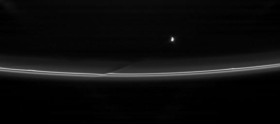 Prometheus pulls away from an encounter with Saturn's F ring, leaving behind a reminder of its passage. This image was taken in visible light with NASA's Cassini spacecraft's narrow-angle camera on April 18, 2007.