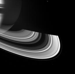 Saturn and its rings manifest a rich interplay between shadow and light in this image from NASA's Cassini spacecraft. The rings shine on their unilluminated side by virtue of scattered sunlight emerging from its passage through the ringplane.
