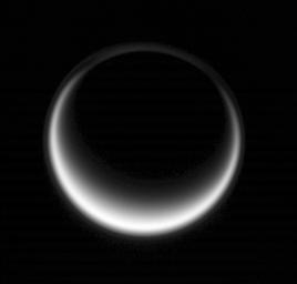 Sunlight scatters through Titan's atmosphere, illuminating high hazes and bathing the entire moon in a soft glow in this image from NASA's Cassini spacecraft taken on May 12, 2007.