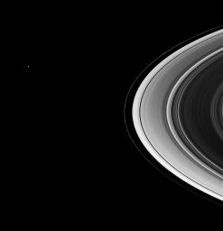 The shepherd moons Prometheus and Pandora drive the quirky F ring in its circuit of Saturn, while Mimas lurks in the distance. This image was taken in visible green light with NASA's Cassini spacecraft's wide-angle camera.