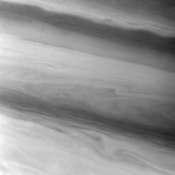 NASA's Cassini spacecraft spies smooth, sometimes wavy, contours in the banded east-west flowing clouds of Saturn. This view shows clouds in Saturn's northern mid-latitudes.