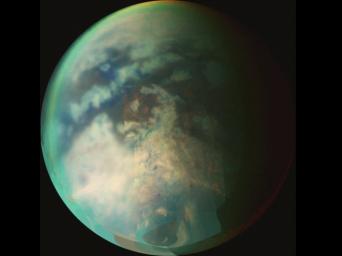 This image from NASA's Cassini spacecraft is a composite of several images taken during two separate Titan flybys on Oct. 9 (T19) and Oct. 25 (T20). The large circular feature near the center of Titan's disk may be the remnant of a very old impact basin.