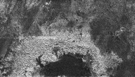 This radar image from NASA's Cassini spacecraft of Titan shows a semi-circular feature that may be part of an impact crater. Very few impact craters have been seen on Titan so far, implying that the surface is young.