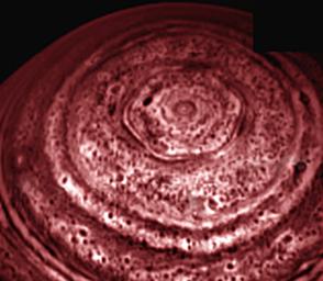 A bizarre six-sided feature encircling the north pole of Saturn has been spied by the VIMS on NASA's Cassini spacecraft. This image is one of the first clear images ever taken of the north polar region as seen from a unique polar perspective.
