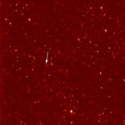 A white arrow marks Pluto in this NASA New Horizons Long Range Reconnaissance Imager picture taken Sept. 21, 2006. Pluto is little more than a faint point of light among a dense field of stars.