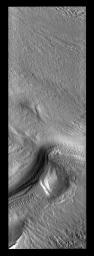 This image from NASA's Mars Odyssey spacecraft shows low sun angles of spring beautifully illuminate the subtle surface textures of Mars' south polar cap.