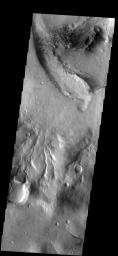 This image from NASA's Mars Odyssey spacecraft shows dark dunes located on the floor of an unnamed crater north of Rabe Crater.