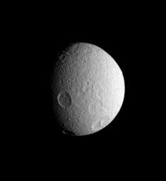 NASA's Cassini spacecraft spies four large impact basins on the southern hemisphere of icy Tethys. Tethys, like the other airless worlds of the Solar System, wears the record of countless impacts experienced over the eons.