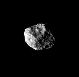 Giant craters like the one seen in this view deform the shape of Hyperion, making it the largest irregularly-shaped body in the Saturn system. This image was taken by NASA's Cassini spacecraft.