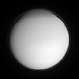 Titan's detached, high-altitude haze layer encircles its smoggy globe in this ultraviolet view, which also features the moon's north polar hood. This image was taken with NASA's Cassini spacecraft's narrow-angle camera on Sept. 2, 2007.