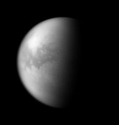 Through the obscuring haze come glimpses of Titan's dune seas. The dark, equatorial region known as Shangri-la is visible here. This image was taken with NASA's Cassini spacecraft's narrow-angle camera on Oct. 19, 2007.