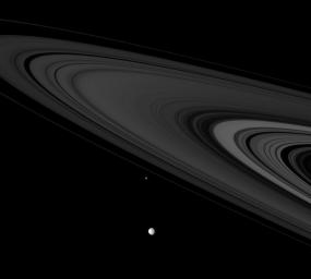 NASA's Cassini spies two icy denizens, Mimas and Epimetheus, of the Saturn System as they hurtle past in this image taken on Nov. 6, 2007.