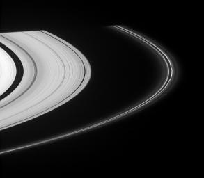 A section of Saturn's perturbed F ring displays kinks in its bright strands. At left, edge waves in the Encke Gap, caused by the presence of Pan is seen, along with two faint ringlets. This image was captured by NASA's Cassini spacecraft on Nov. 14, 2007.