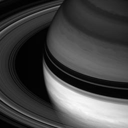 Saturn's rings sweep around the planet, throwing their dark shadows onto the northern hemisphere in this image captured by NASA's Cassini spacecraft.