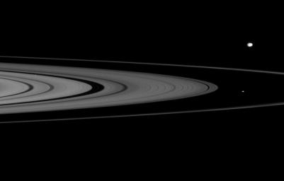 On Jan. 17, 2008, NASA's Cassini spacecraft spied two of Saturn's small moons, Atlas and Epimetheus, that skirt the edges of the planet's rings.