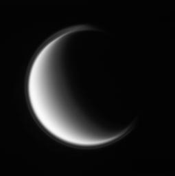 NASA's Cassini spacecraft peers at the smooth globe of Titan, wrapped in its photochemical haze. The moon's thin, detached, high-altitude haze layer is best viewed at shorter wavelengths of light, as in this violet light image and ultraviolet views.