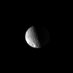 On Mar. 11, 2008, NASA's Cassini spacecraft looked toward the high north on Saturn's heavily cratered moon, Mimas. The unmistakable Herschel impact crater is seen at lower left.