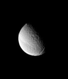 From a highly inclined orbit, NASA's Cassini spacecraft looks toward far northern latitudes on Saturn's moon Tethys. Here, the spacecraft was above a position about 45 degrees north of the moon's equator.