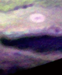 In this frame from a movie, put together from false-color images taken by the New Horizons Ralph instrument as the spacecraft flew past Jupiter in early 2007, show ammonia clouds (appearing as bright blue areas) as they form and disperse.