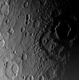 As NASA's MESSENGER approached Mercury on January 14, 2008, the spacecraft's Narrow-Angle Camera on the Mercury Dual Imaging System (MDIS) instrument captured this view of the planet's rugged, cratered landscape illuminated obliquely by the Sun.