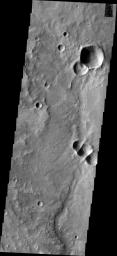 This image from NASA's Mars Odyssey shows where a meteor which impacted Mars close together causing three craters to be created simultaneously.