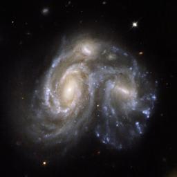 NGC 6050/IC 1179 (Arp 272) is a remarkable collision between two spiral galaxies, NGC 6050 and IC 1179, and is part of the Hercules Galaxy Cluster, located in the constellation of Hercules. This image is from NASA's Hubble Space Telescope.
