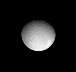 This view of Saturn's moon Rhea includes two large and ancient impact basins and a more recent, bright ray crater. This image was taken in visible light with NASA's Cassini spacecraft's narrow-angle camera on May 13, 2008.
