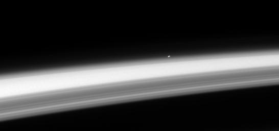 The nearest star system, the trinary star Alpha Centauri, hangs above the horizon of Saturn. Both Alpha Centauri A and B, stars very similar to our own, are clearly distinguishable in this image captured by NASA's Cassini spacecraft on May 17, 2008.