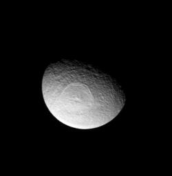 Saturn's icy moon Tethys sports an enormous impact basin, Odysseus. The impact basin is 280-miles wide and contains a central complex of mountains. This image was taken in visible light with NASA's Cassini spacecraft's narrow-angle camera.