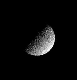 Deep craters riddle the pulverized, icy surface of Saturn's moon Mimas in this image captured by NASA's Cassini spacecraft on June 16, 2008.