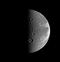 Bright, wispy-looking fractures reach across the rugged, icy landscape of Saturn's moon, Dione. This image was taken in visible light with NASA's Cassini spacecraft's narrow-angle camera on July 21, 2008.