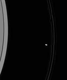 As Prometheus pulls away from an encounter with Saturn's F ring, its immediate effects on the ring material are clear. This image was captured by NASA's Cassini spacecraft on Aug. 6, 2008.