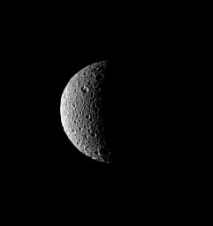 The sun's low angle near the terminator throws the craters of Saturn's moon, Mimas, into stark relief in this image was captured by NASA's Cassini spacecraft on Aug. 4, 2008.