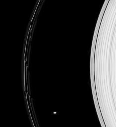 The gravity of Prometheus alters the orbits of the fine, icy particles in Saturn's F ring, creating dazzling structures in this image captured by NASA's Cassini spacecraft on Aug. 30, 2008.