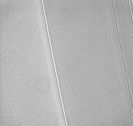 A close-up of Saturn's A ring reveals dozens of small, bright streaks aligned with the orbital direction of the rings in this image captured by NASA's Cassini spacecraft on Sept. 25, 2008.