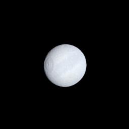 Tethys' dark equatorial band is seen in natural color on the moon's leading hemisphere. The largest impact basin on Saturn's moon Tethys, Odysseus, appears on the left in this image taken by NASA's Cassini spacecraft on Oct. 27, 2008.