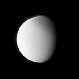 Titan's globally distributed detached haze layer and the moon's north polar hood, both notable details of its thick atmosphere, are clearly seen in this image from NASA's Cassini spacecraft. Titan is 5,150 kilometers across, slightly larger than Mercury.