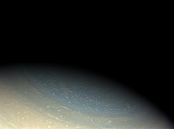 Saturn's north pole retains its bluish hue in this true color Cassini image, even as northern winter is coming to an end. This image was acquired with NASA's Cassini spacecraft's wide-angle camera on Nov. 29, 2008.