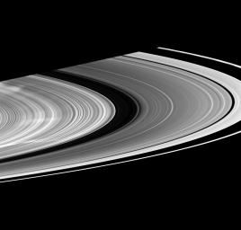 Three large white spokes stretch out across the B ring in this image from NASA's Cassini spacecraft taken on Jan.14, 2009.
