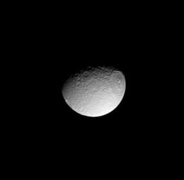 The humongous Odysseus impact basin stretches on and on across Saturn's moon, Tethys, in this image from NASA's Cassini spacecraft taken on Jan. 2, 2009.