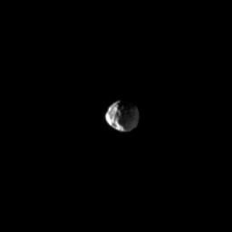 NASA's Cassini spacecraft looks down on the cratered northern leading hemisphere of Dione, showing the moon's pockmarked surface in this image taken on June 11, 2009.