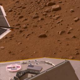 This image, released on Memorial Day, May 26, 2008, shows the American flag and a mini-DVD on the Phoenix's deck, which is about 3 ft. above the Martian surface.