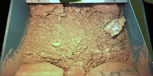 NASA's Phoenix Mars Lander scooped its first martian soil on June 5, 2008 as the first soil sample for delivery to the laboratory on the lander deck.