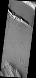 This image from NASA's Mars Odyssey shows a ridge located in Acheron Fossae, a large, arcuate set of faulted ridges north of Lycus Sulci and Olympus Mons.