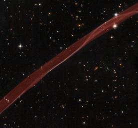 A delicate ribbon of gas floats eerily in our galaxy. This image, taken by NASA's Hubble Space Telescope, is a very thin section of a supernova remnant caused by a stellar explosion that occurred more than 1,000 years ago.